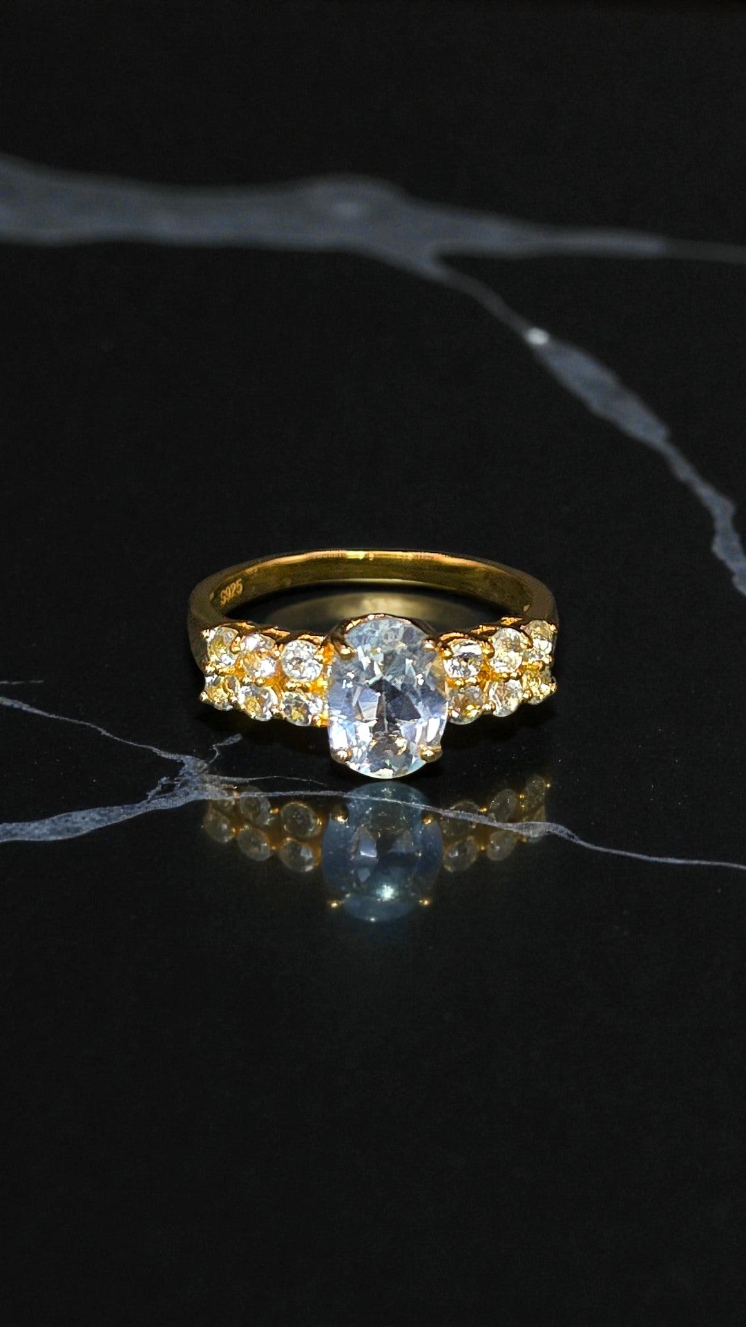 NYX – LARGE NATURAL BLUE TOPAZ GEMSTONE RING PLATED IN YELLOW GOLD