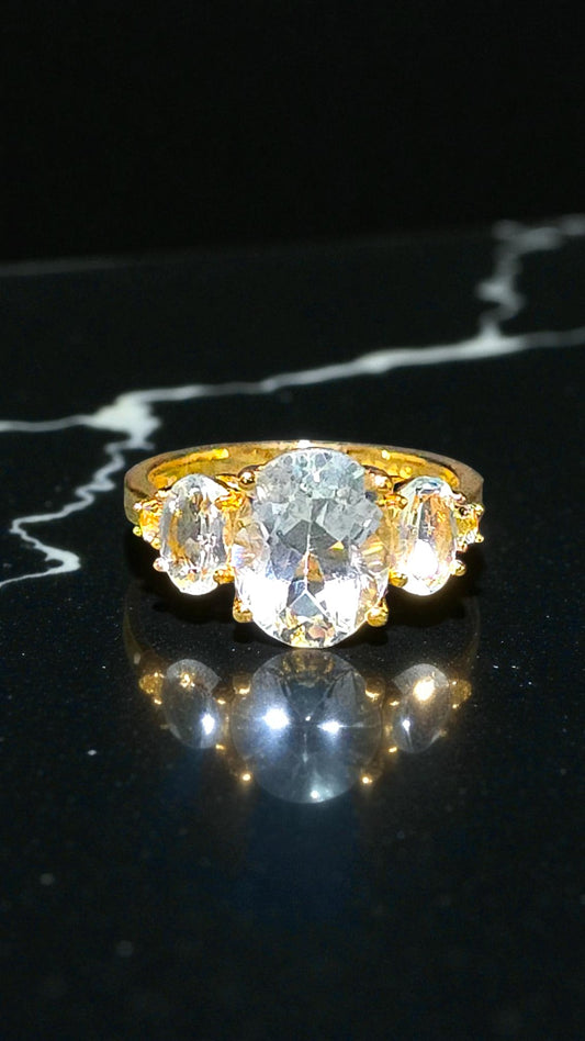 HARMONIA – BLUE TOPAZ GEMSTONE RING PLATED IN YELLOW GOLD